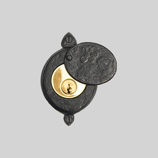 Shown with a dark wax iron and polished brass finish.