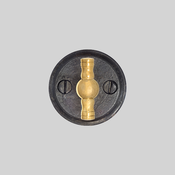 Shown with a dark wax iron and polished brass finish.
