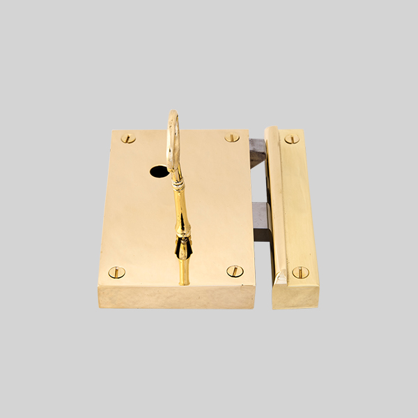 Shown as right hand with a polished brass finish.