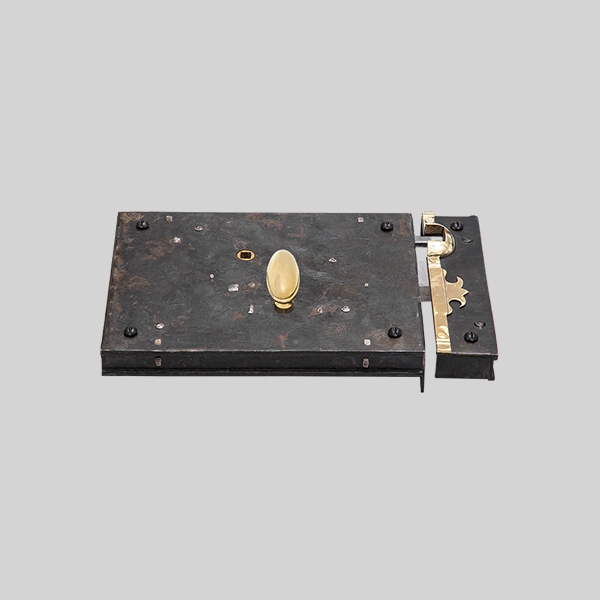 Shown as right hand with a dark wax iron finish.