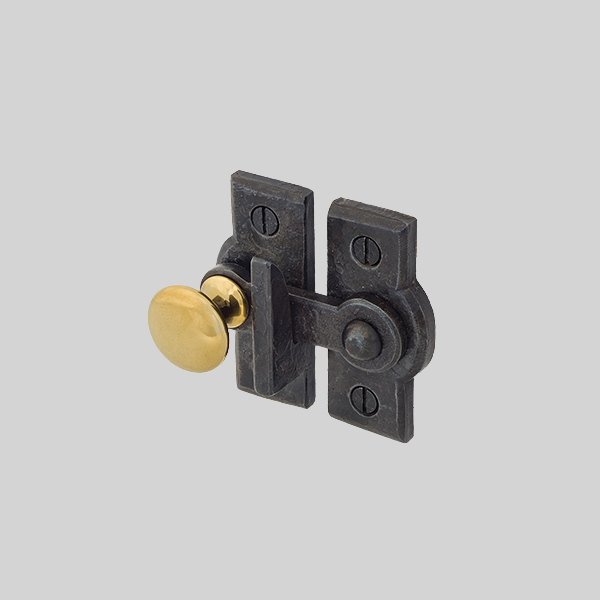 Shown with a dark wax and polished brass finish.