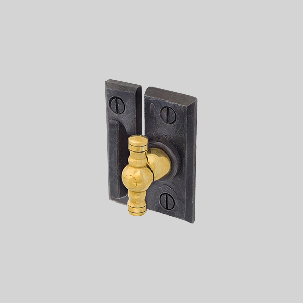 Shown with a dark wax and polished brass finish.